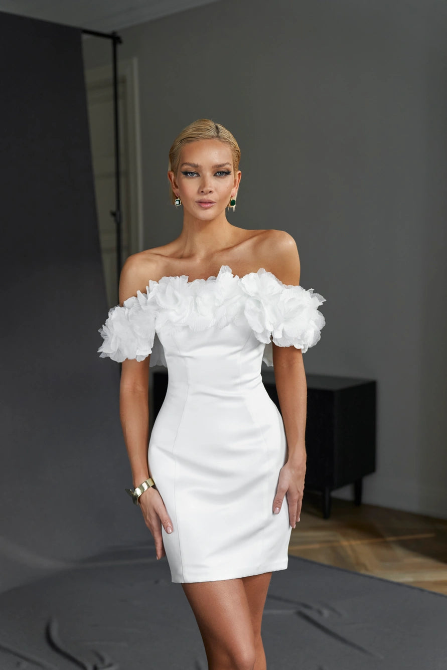 Off-the-shoulder form fitting short wedding dress with zipper back. Decorated with organza flowers.