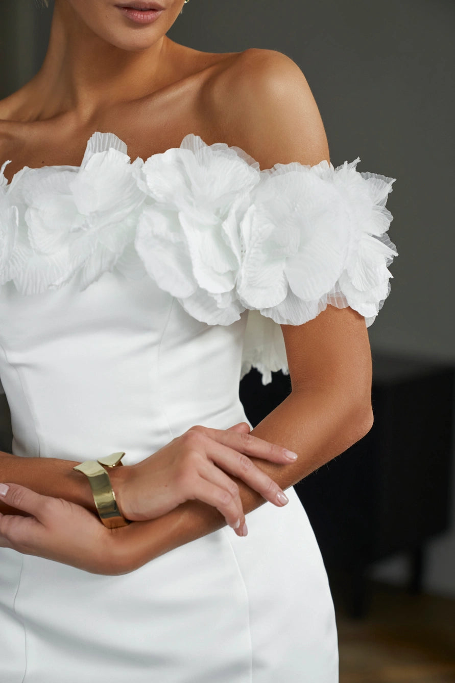 Off-the-shoulder form fitting short wedding dress with zipper back. Decorated with organza flowers.