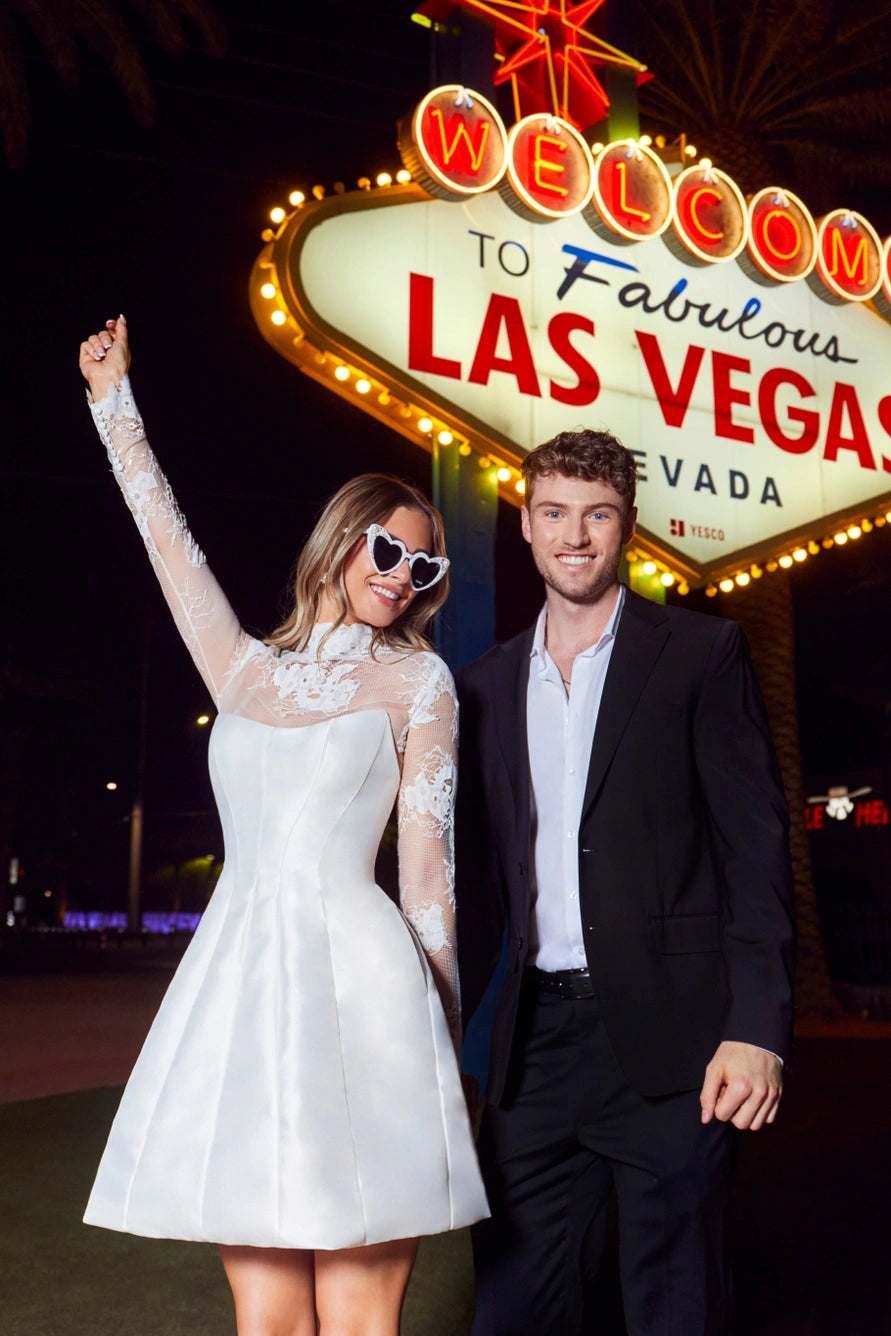 Short wedding dress with a removable bolero and a zippered back.