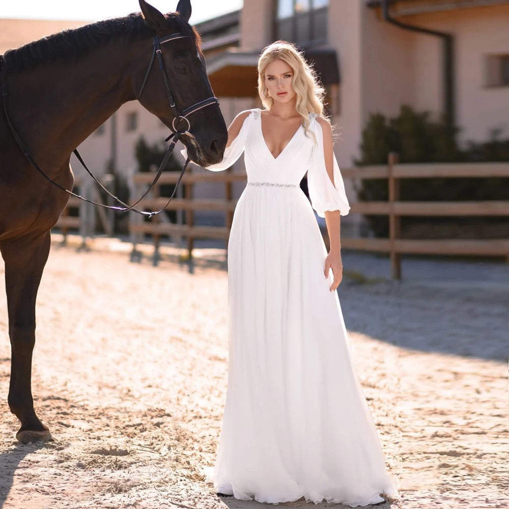 Eleganti abiti da sposa in chiffon bianco v maniche lunghe per collo lunghezza per il pavimento senza schienale.