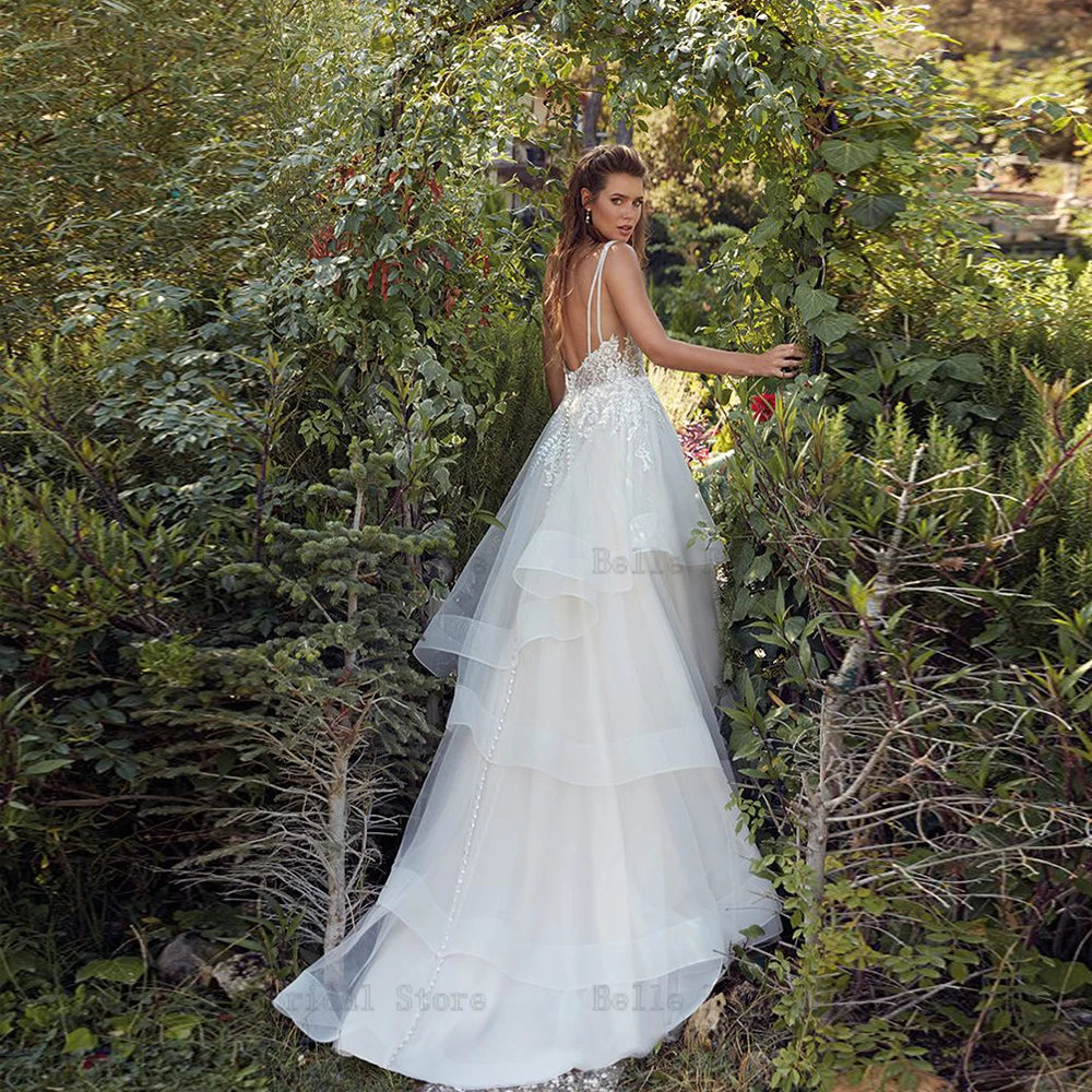 Elegantes correas de espagueti vestidos de novia V cuello sin mangas A-línea vestidos de novia apliques longitud de piso tul vestidos de novia