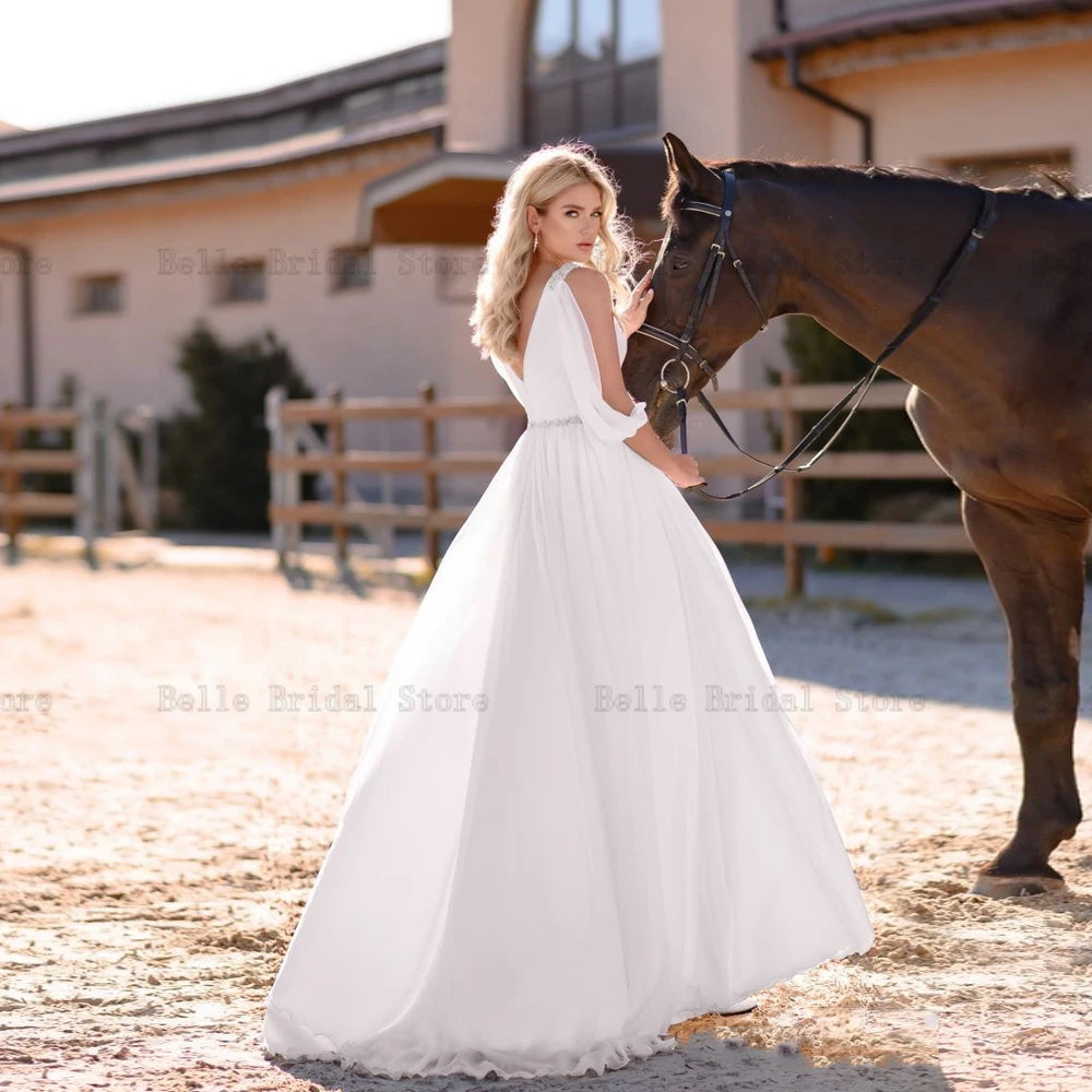 Eleganti abiti da sposa in chiffon bianco v maniche lunghe per collo lunghezza per il pavimento senza schienale.