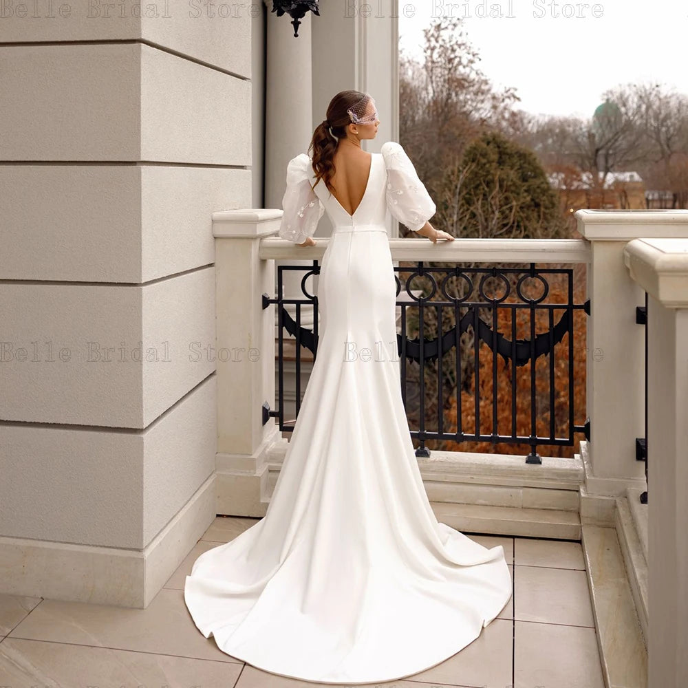 Elegantes vestidos de novia de sirena de sirena o cuello con mangas de hojaldre.