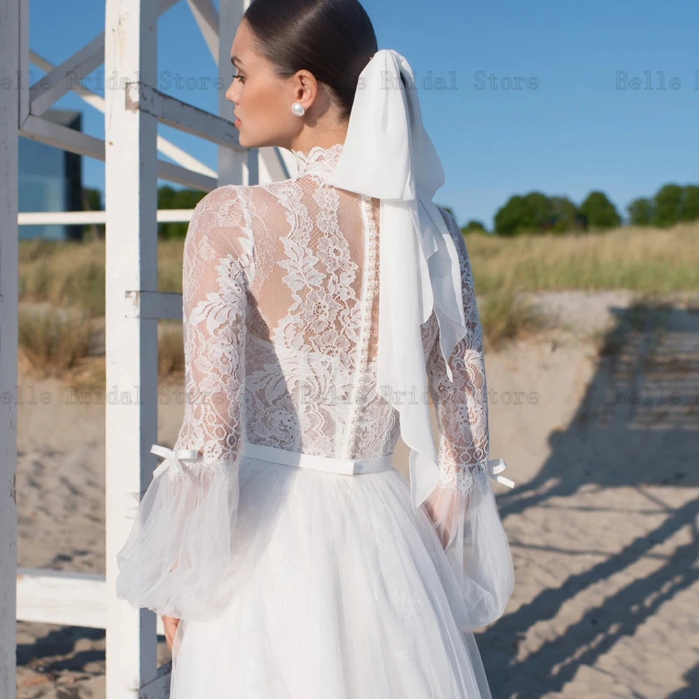 Elegantes vestidos de novia marfil de marfil mangas largas con mangas largas.