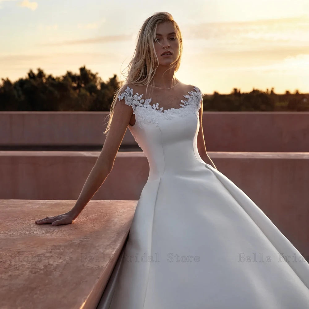 Elegantes vestidos de novia Mangas de la gorra del cuello joya Apliques del botón de retroceso del piso Longitud A-Línea Vestidos de Novia