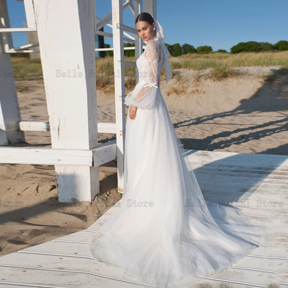 Elegantes vestidos de novia marfil de marfil mangas largas con mangas largas.