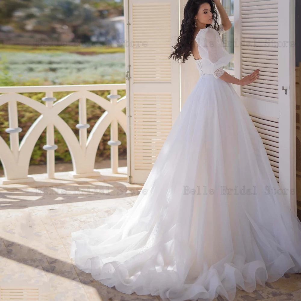 Robes de mariée simples manches bouffantes cou chéries