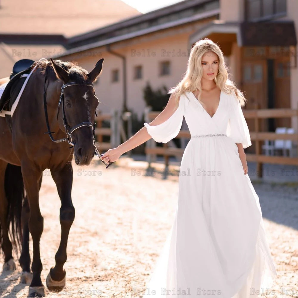 Eleganti abiti da sposa in chiffon bianco v maniche lunghe per collo lunghezza per il pavimento senza schienale.